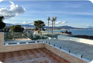 a swimming pool with a view of the water at Dreamy ocean getaway! Renovated bungalow in M'diq