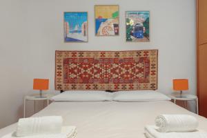 En eller flere senge i et værelse på Trieste da vivere, la tua casa in centro con WiFi