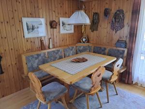 a dining room with a wooden table and chairs at Apartment Bijou by Interhome in Alt Sankt Johann