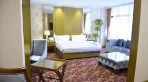 Giường trong phòng chung tại Edmond hôtel