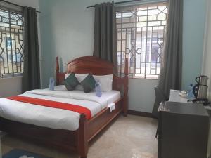 Giường trong phòng chung tại DAG HOTEL Morogoro