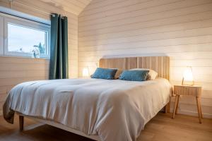 En eller flere senge i et værelse på Gîte du Chemin - Calme et forêt