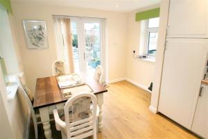 a kitchen with a table and chairs in a room at 1 Bed in Bishopston oc-hh648 in Bishopston