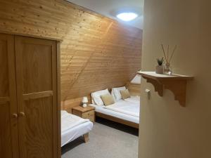 En eller flere senge i et værelse på Rodinný penzion Míša