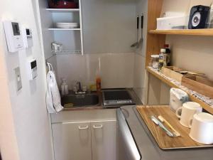 a small kitchen with a sink and a counter at PhaseSpace in Sekimachi