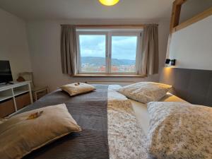 Postel nebo postele na pokoji v ubytování Ferienwohnung Auszeit + 25 fotografií