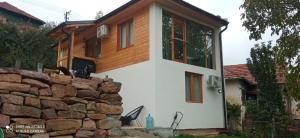 a house with a stone wall at vila Damascena in Pirot