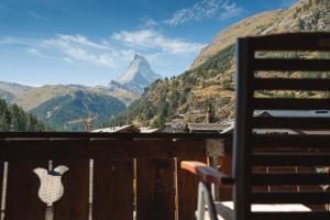 a view of a mountain from a balcony at Hotel Matterhornblick in Zermatt