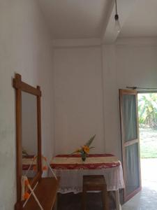 a room with a bed and a table and a window at White Horizon 2 in Ahangama +18 photos