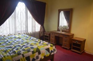 Postel nebo postele na pokoji v ubytování Villa Omah Jamuniro