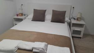 Postel nebo postele na pokoji v ubytování Aurora1 Belén Alojamiento en el casco histórico