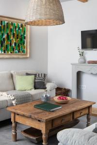 a living room with a coffee table and a couch at Holiday Home mit eigenem Pool by Interhome in Čepljani