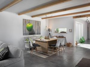 a kitchen with a table and chairs in a room at Holiday Home mit eigenem Pool by Interhome in Čepljani +21 photos
