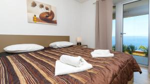 En eller flere senge i et værelse på Villa Julia - Korcula by Villas Guide + 23 billeder