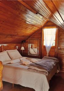 En eller flere senge i et værelse på Pousada Quinta das cores