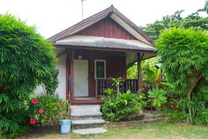 a small house with stairs leading to it at Weekender Bungalow in Lamai