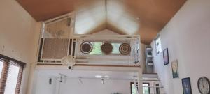 a room with a ceiling with a window in it at Sunny House Homestay in Tam Ðảo