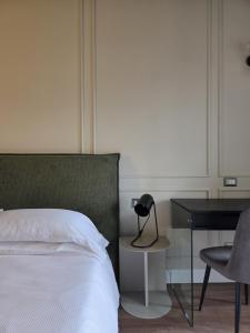 Postel nebo postele na pokoji v ubytování Corso Italia Rooms