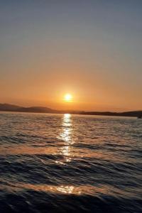 a sunset over a body of water at Apartment Oberwilen by Interhome in Vitznau