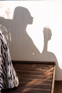 a shadow of a couple on the side of a car at VAYA Suites by Omilos Hotels in Amoudara Herakliou