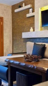 a wooden table with a tray of pine cones on it at Deluxe 707 in Borovets