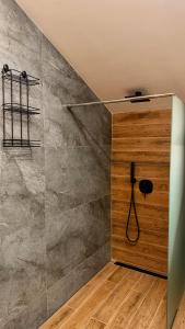 a shower in a bathroom with a glass wall at Deluxe 707 in Borovets +7 photos