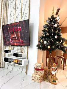 TV a/nebo společenská místnost v ubytování ApartPodhale