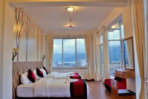Rúm í herbergi á Hotel City Inn - Mountain View