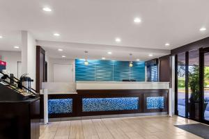 a kitchen with a bar with a view of the ocean at Best Western Starke in Starke +17 photos