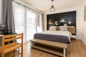 a bedroom with a bed and a large window at Sweet Evasion - Wifi - Host Provence in Toulon