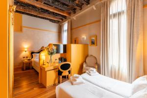 En eller flere senge i et værelse på Hotel Ca' Zusto Venezia