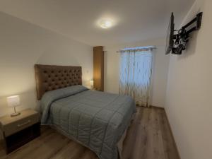 Giường trong phòng chung tại Casona Apartament