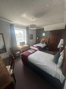 Postel nebo postele na pokoji v ubytování West Rocks Townhouse