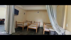 Et tv og/eller underholdning på Pousada Cantinho e Sossego casa 5