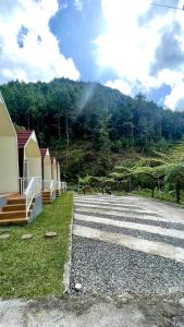 een groep hutten langs de weg bij Diiza Glamping Tawangmangu Private Pool No BBQ in Tawangmangu