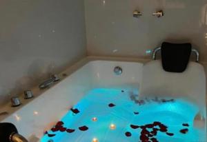 a bathroom with a tub with a floor covered in debris at Hotel Killasumaq in Cajamarca