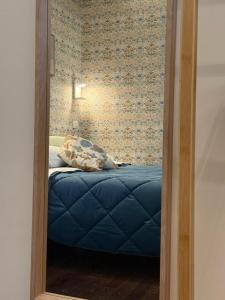a mirror reflection of a bed in a bedroom at Old Town Nest in Civitavecchia in Civitavecchia +103 photos