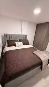 Giường trong phòng chung tại CASA CIELO Quindio