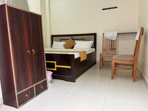 Postel nebo postele na pokoji v ubytování Ma Tulshi Geust House