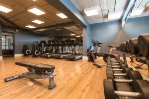 a gym with several treadmills and exercise bikes at Casa Azul Experience at The Perry in Key West