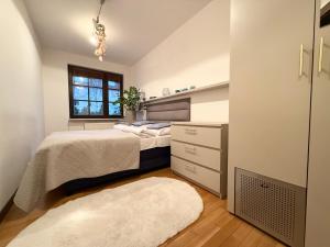 Postel nebo postele na pokoji v ubytování Apartament Odkryta 36a