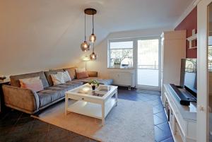 TV/trung tâm giải trí tại Fewo C am Kurpark mit MeineCardPlus in Bestlage!