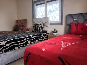 En eller flere senge i et værelse på Villa stade Moulay Abdellah