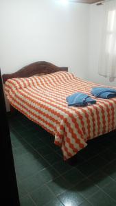 En eller flere senge i et værelse på Casa Piramides