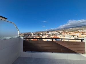a balcony with a view of a city at Paraiso View Duplex Penthouse in Callao Salvaje