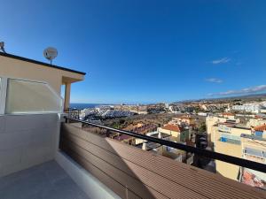 a balcony with a view of a city at Paraiso View Duplex Penthouse in Callao Salvaje
