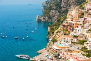 a view of the amalfi coast with boats in the water at Casa Cinque in Positano