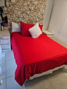 En eller flere senge i et værelse på Elitha Boutique Bed and Breakfast