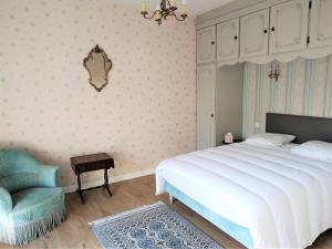 En eller flere senge i et værelse på Villa avec jardin dans un quartier calme au centre de Perros-Guirec - Réf 934