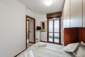 Postel nebo postele na pokoji v ubytování Curiel 194, SmartStay - Appartamento - Ospedale Humanitas, Fiordaliso, Forum Assago